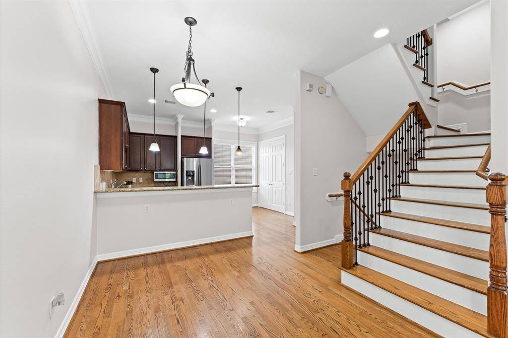 Second floor has the kitchen, breakfast bar and spacious living room with 10 foot ceilings