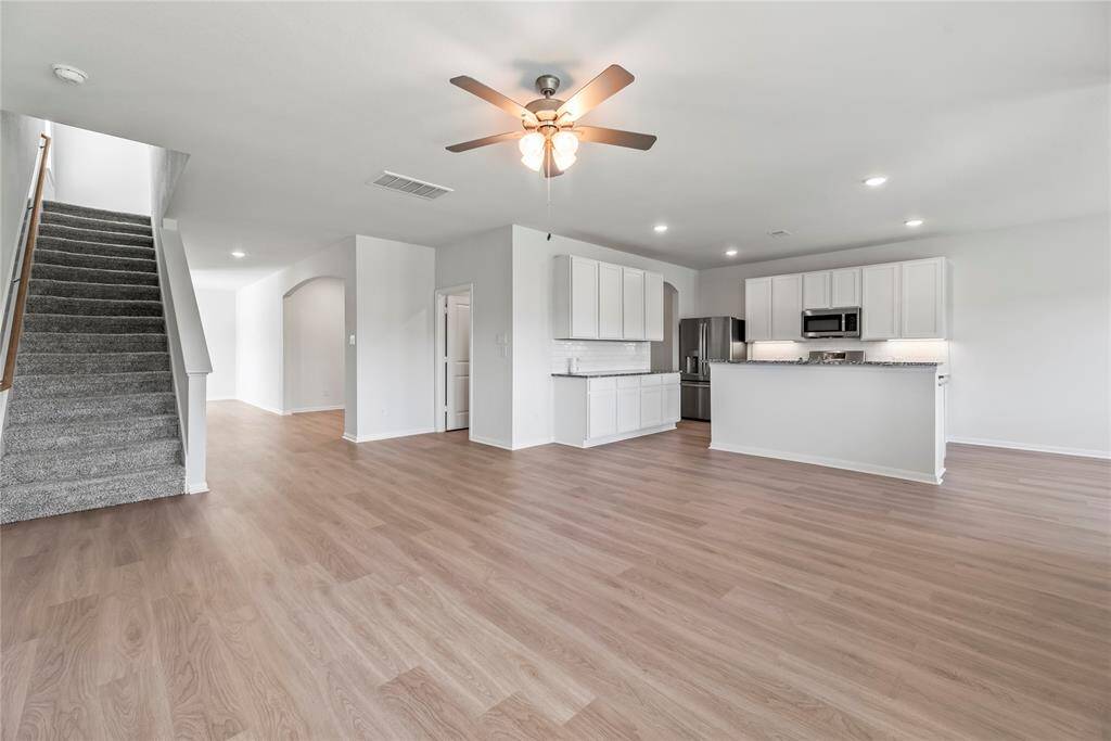 Living room flows seamlessly into the kitchen.