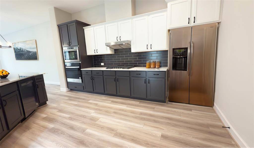 Welcome to the heart of the home - a culinary paradise where design and functionality meld seamlessly to create the ultimate kitchen experience. Image depicts home as is with refrigerator virtually staged.