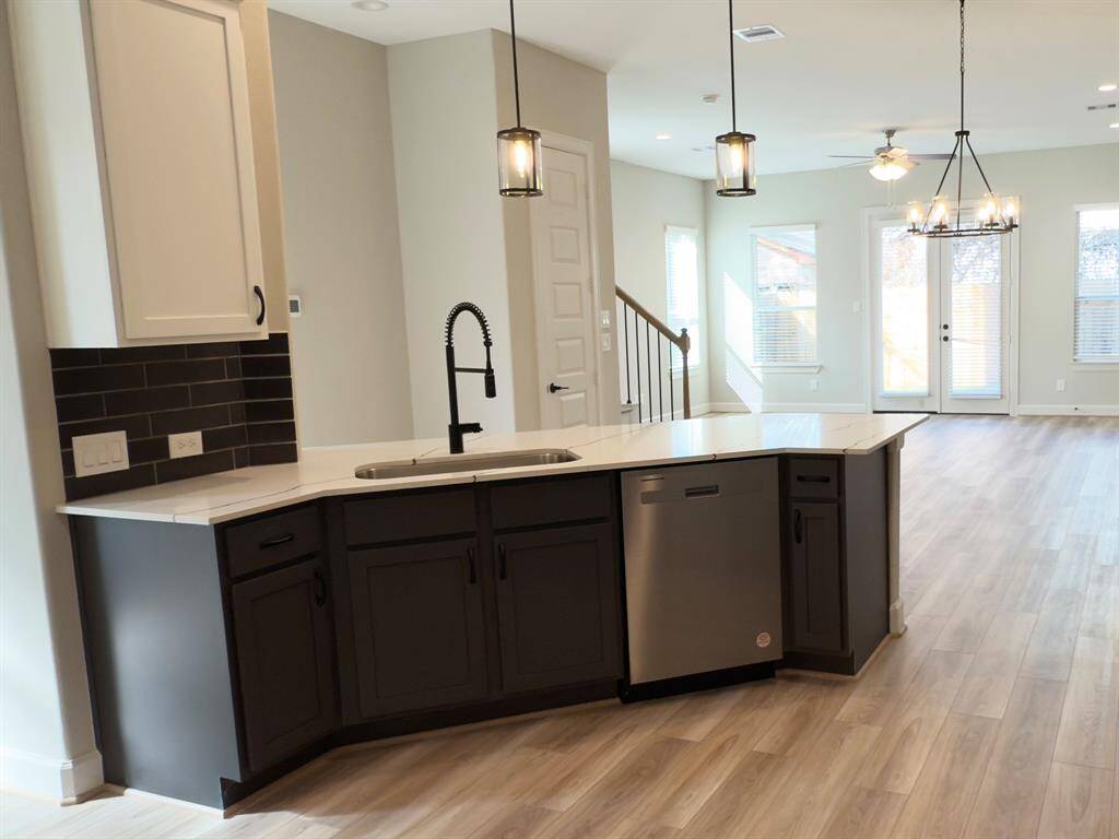 Designed for both culinary creativity and effortless entertaining, the ROCburne kitchen is a masterpiece of style and functionality. Image depicts home as is.