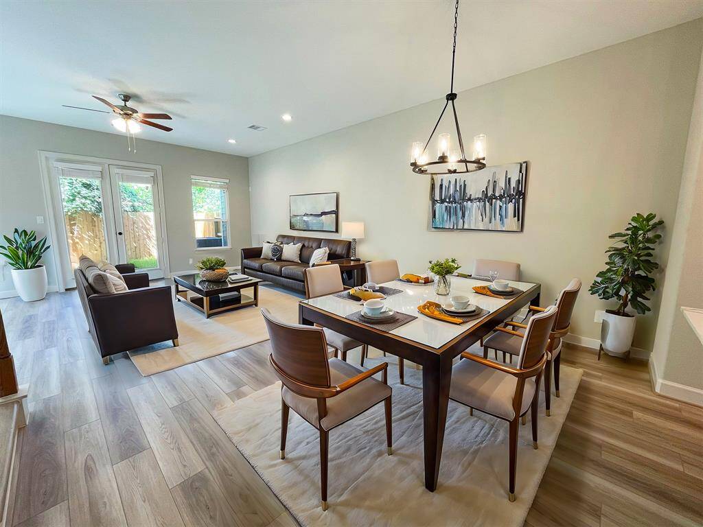Discover an oasis of refined elegance in this stunning dining area, where every meal turns into a luxurious banquet. Image is virtually staged and depicts similar product at another ROC Homes community.