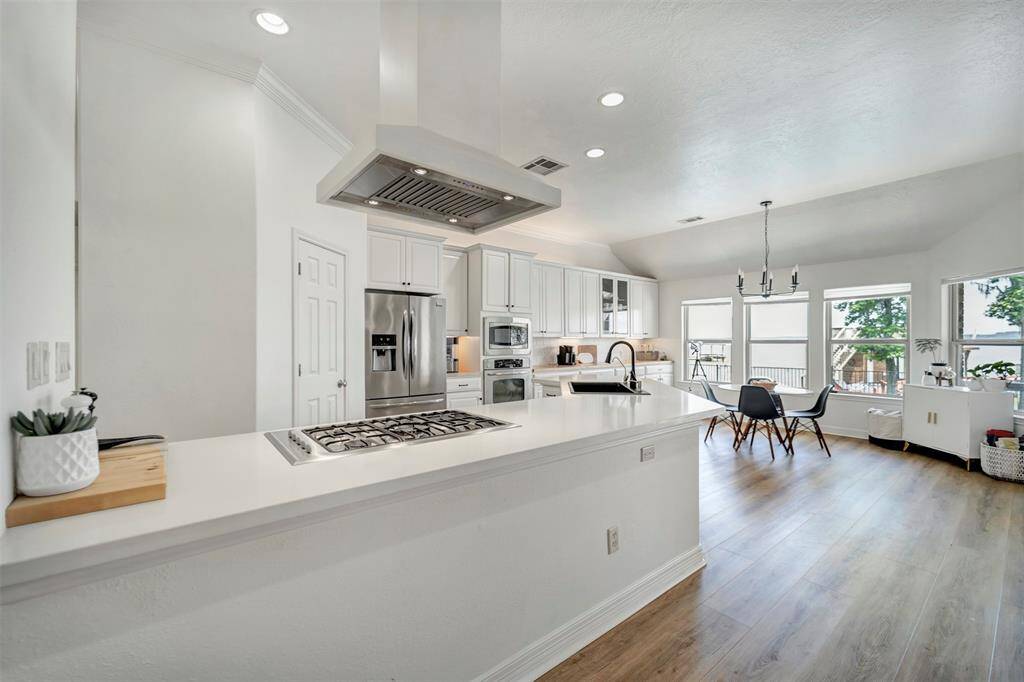 Kitchen and breakfast area featuring stunning panoramic views of the lake