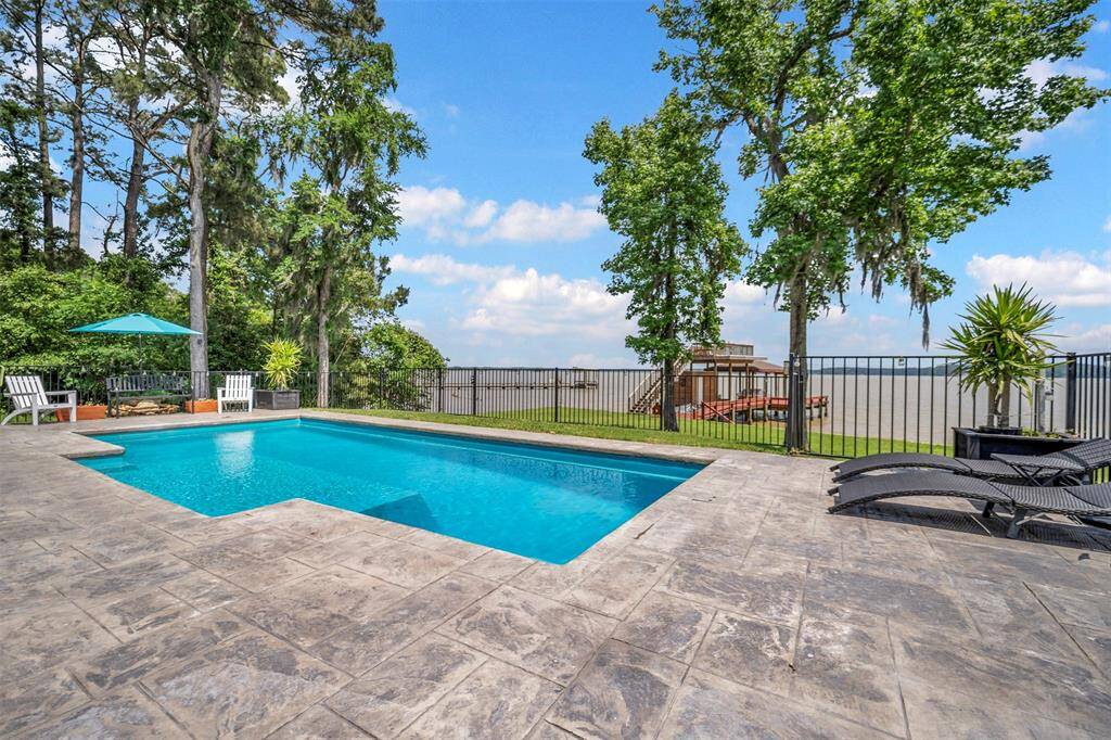 Experience resort-style living while poolside. Ample space to relax and entertain guests while enjoying the expansive outdoor surroundings