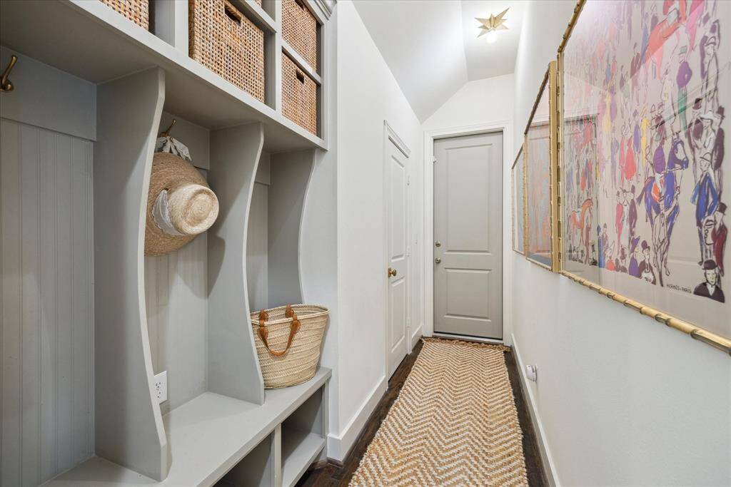 This mudroom provides the perfect space to hang jackets, leave shoes and store items.  It’s even decked out with unlacquered brass hooks and Visual Comfort light fixtures.
