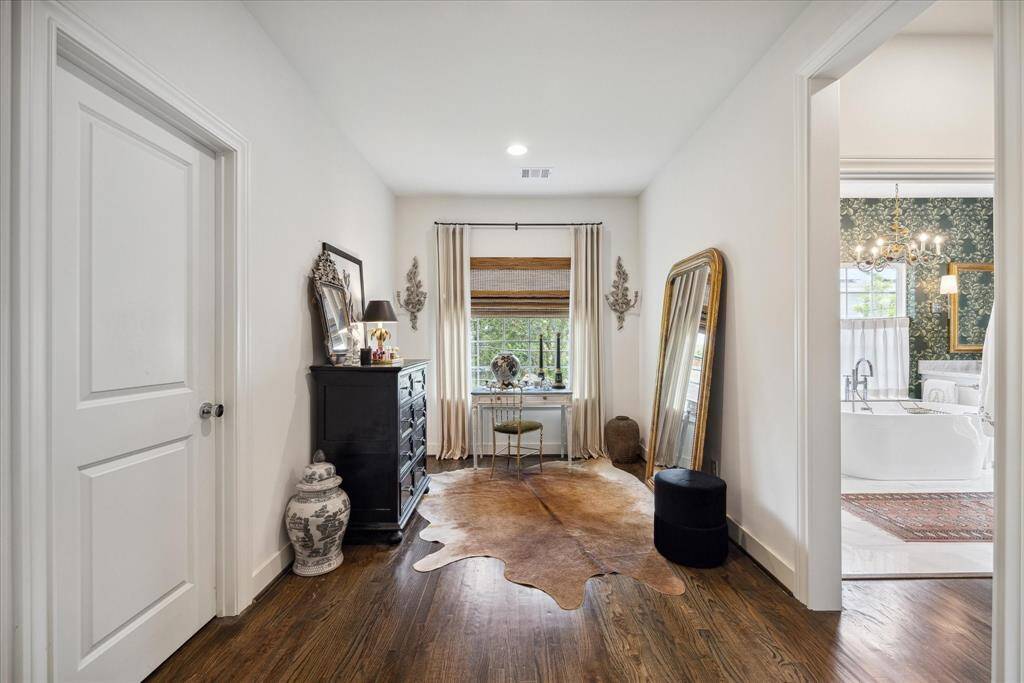 This nook, in the primary bedroom, is the perfect spot for a home office or a place for a chaise lounge so you can chill out with your favorite book.  If you get thirsty or would like a cup of coffee, you don’t have to go far. The coffee bar (not pictured) is just steps away. Walk in closet: to the left; and coffee bar and spa like bath, to the right.