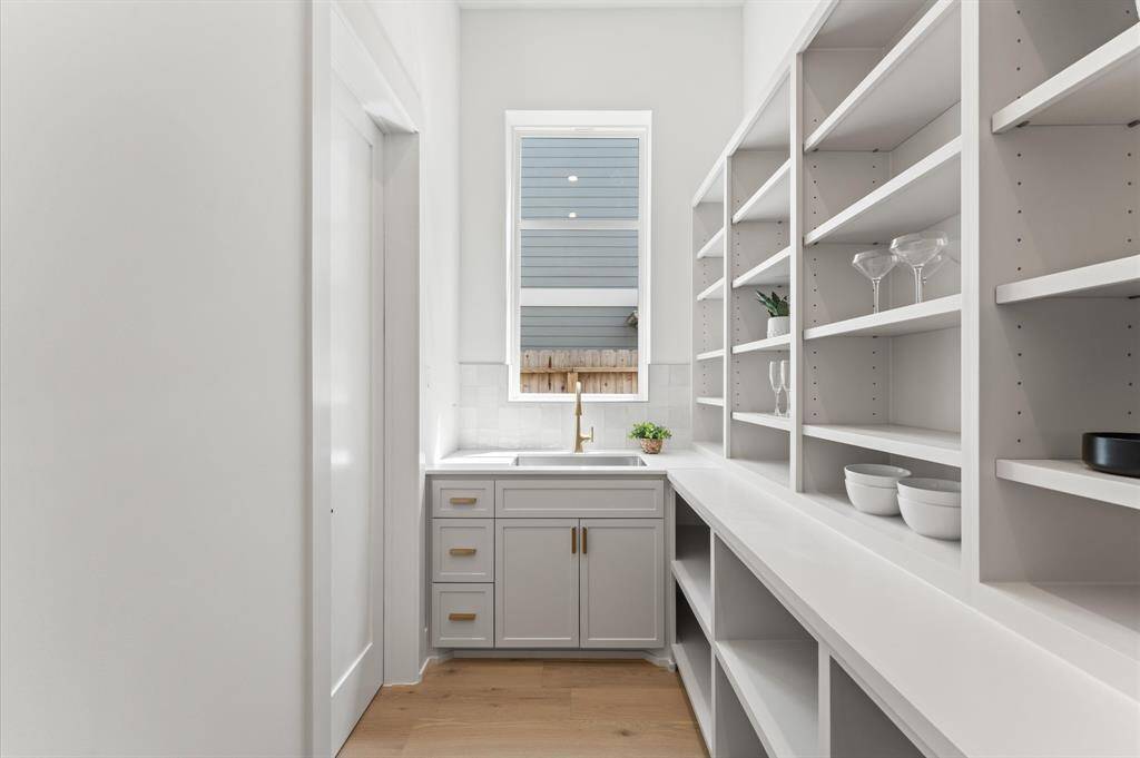 Walk-in butler's pantry with separate sink.