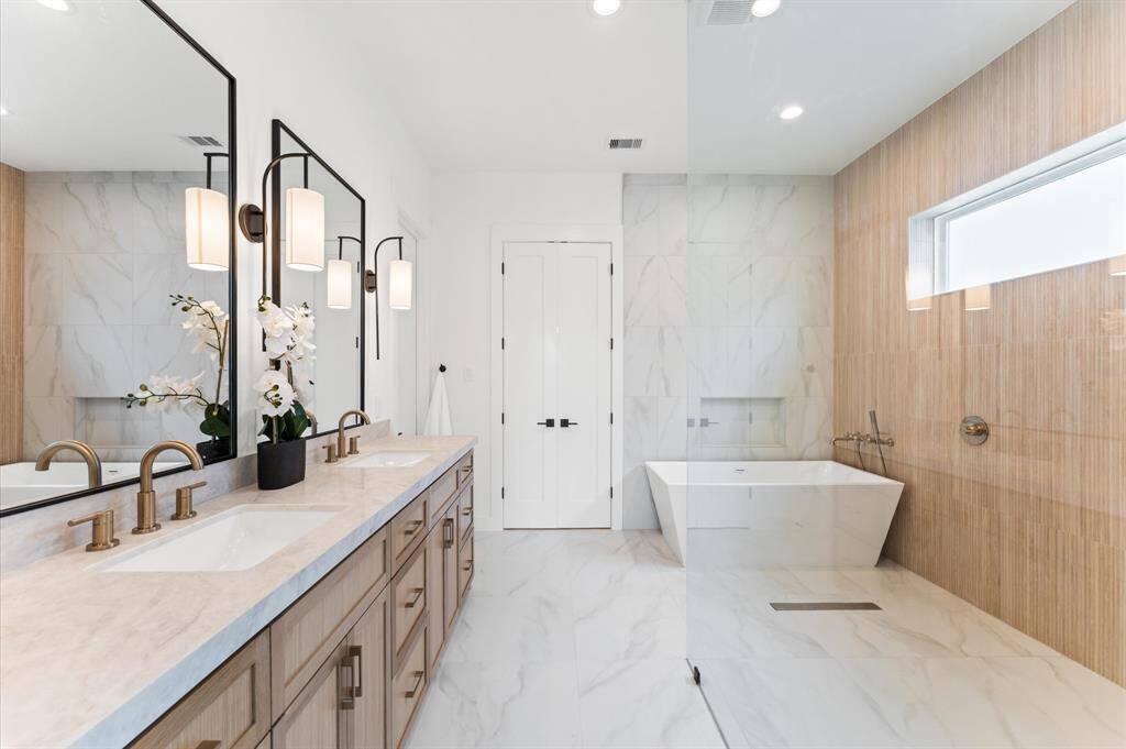 Primary bath has a glass wall curbless shower.