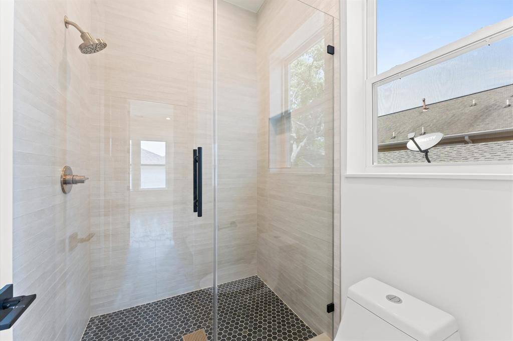 Secondary bath shower area.