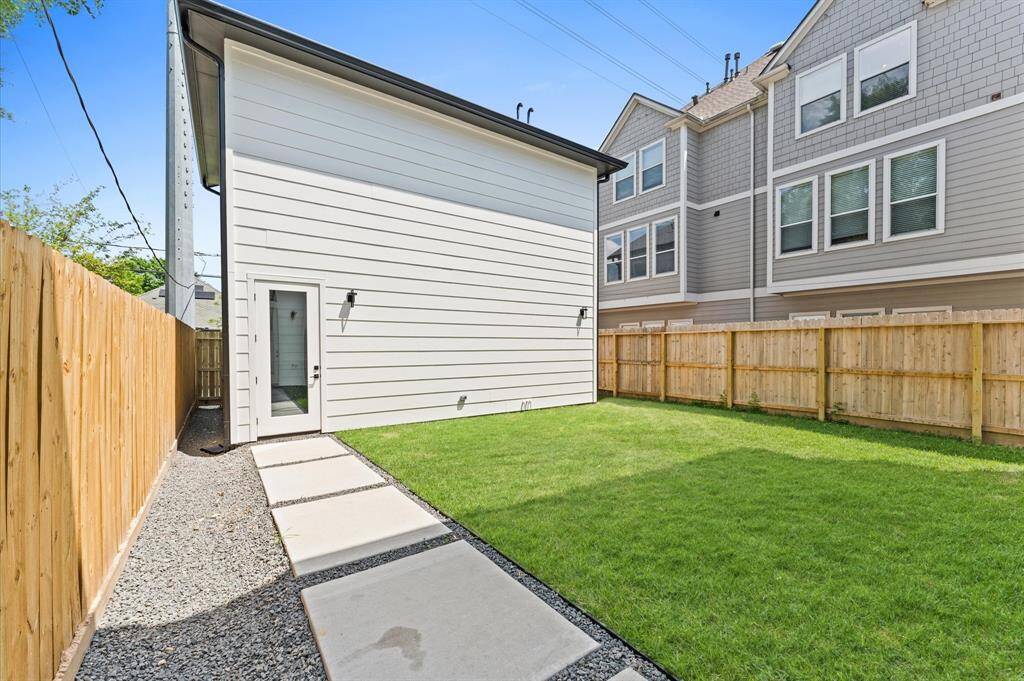 Two car garage off alley has a finished upper story apartment.