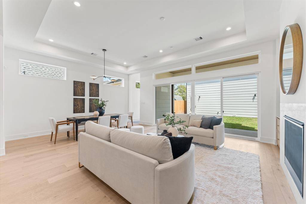 Great room off the kitchen has expansive sliding glass doors that lead to the covered patio. Outdoor patio is stubbed out for appliances.