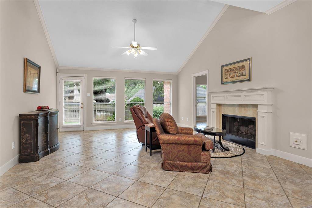 Inviting space by the elegant fireplace, perfect for relaxation.
