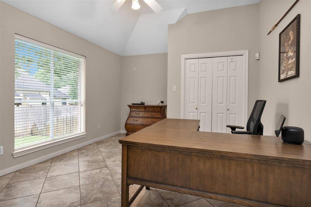 Versatile room ideal as a fourth bedroom or home office, complete with a closet.