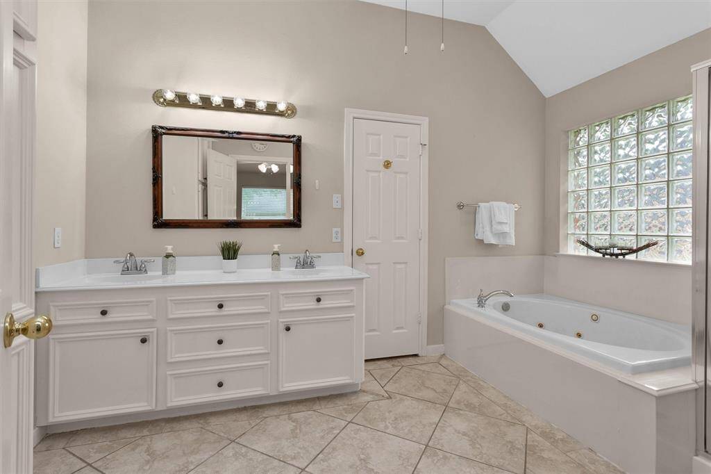 Indulge in luxury with a spa-like bath and spacious walk-in shower.