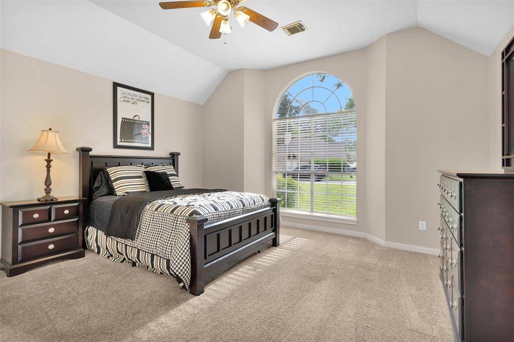 Luxurious primary bath with dual sinks and a spacious walk-in closet.