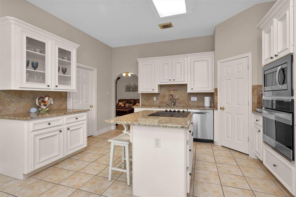 Stunning kitchen with large windows for abundant natural light.