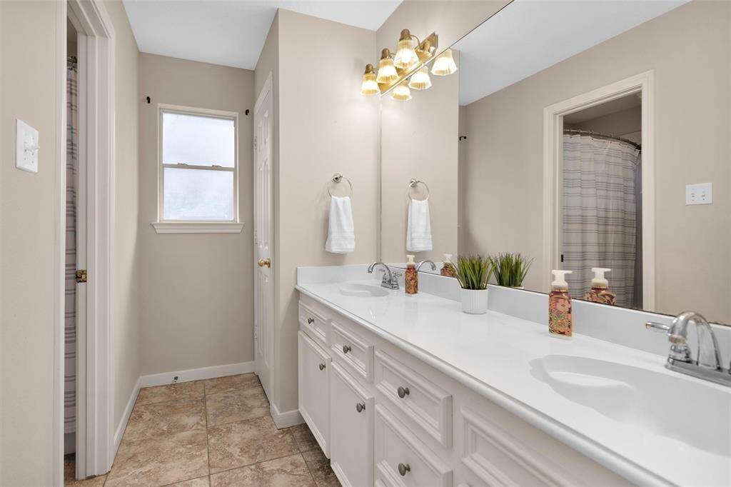 Experience the elegance of a kitchen featuring custom built-in cabinets and a stylish island, perfect for culinary creativity.