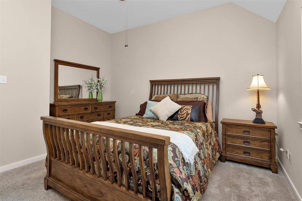 Spacious secondary bathroom featuring elegant double sinks.