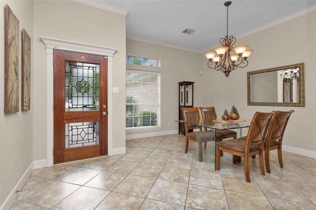 Elegant dining area featuring stunning tile flooring for a sophisticated touch.