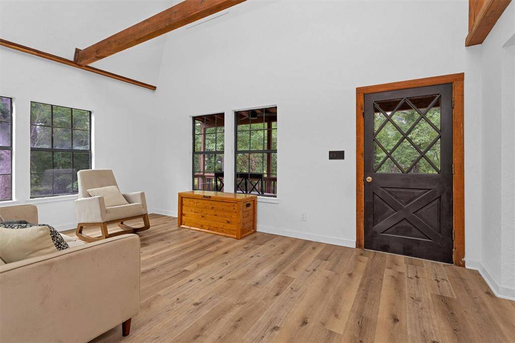 Spacious main living space filled with natural light and rustic charm.