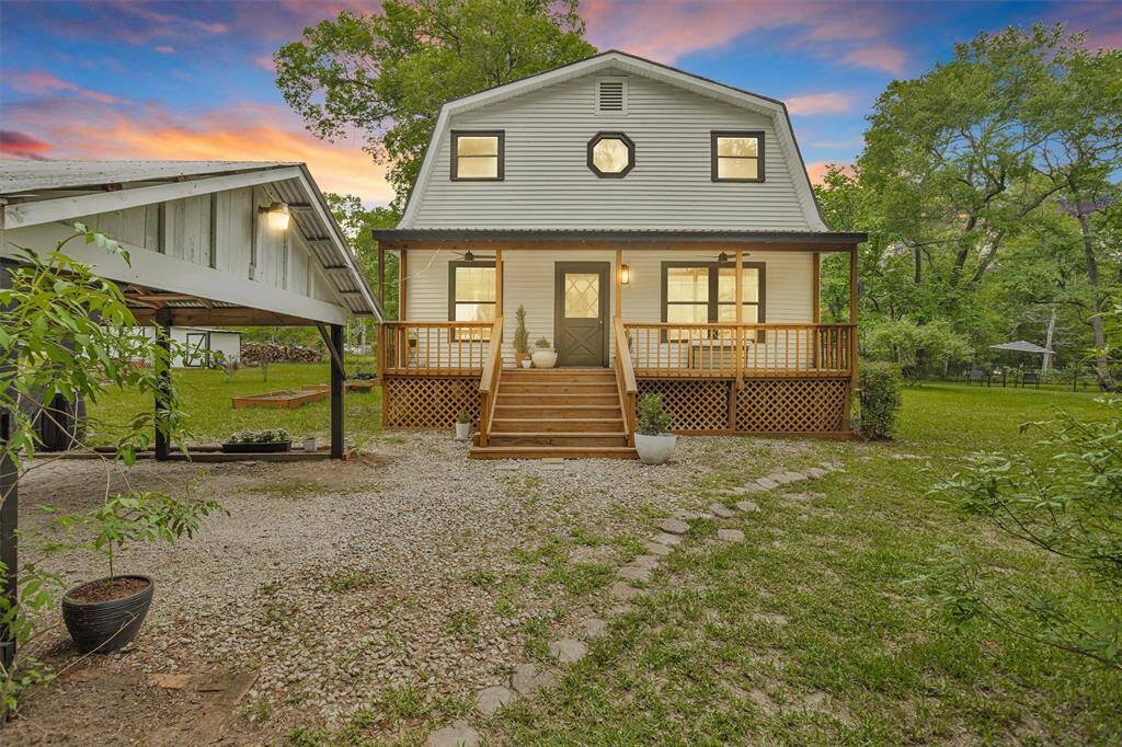 Welcome home to peaceful country living on 1.67 unrestricted acres in the heart of Conroe.