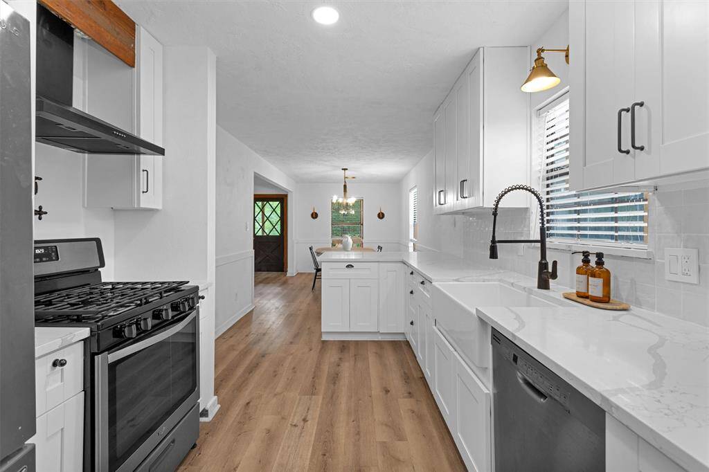 Handcrafted wood cabinetry adds character to this thoughtfully designed kitchen.