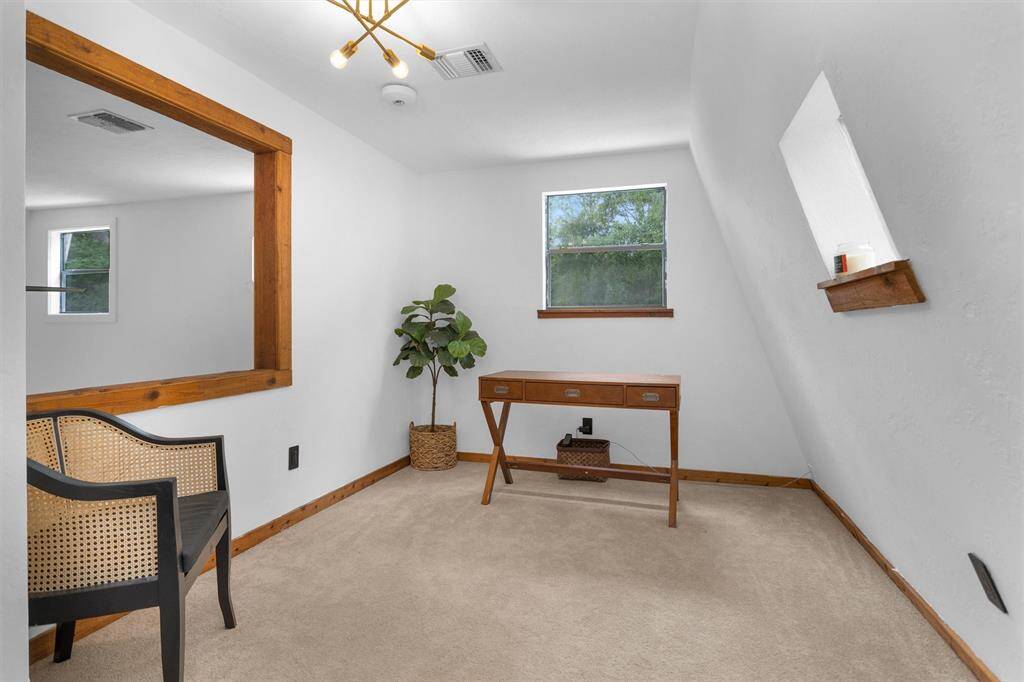 Versatile upstairs space can be used as a fourth bedroom, study, or game room.