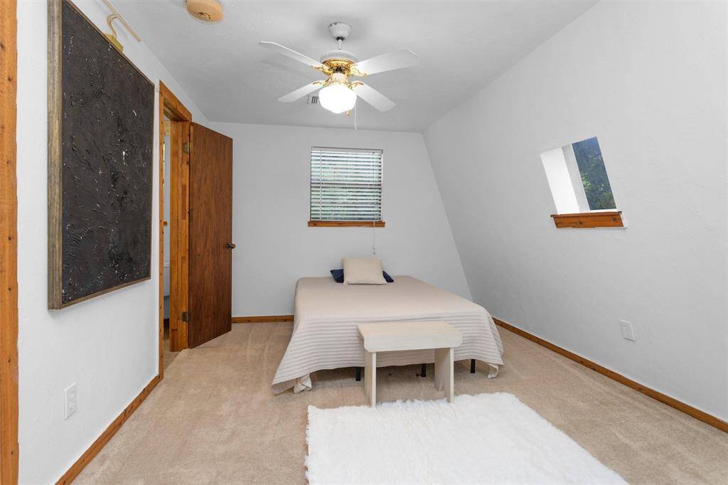 Upstairs bedrooms share a full bath with dual access—ideal for family or guests.