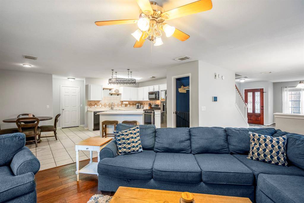 The seamless transition from the living room to the dining area enhances the home's flow.
