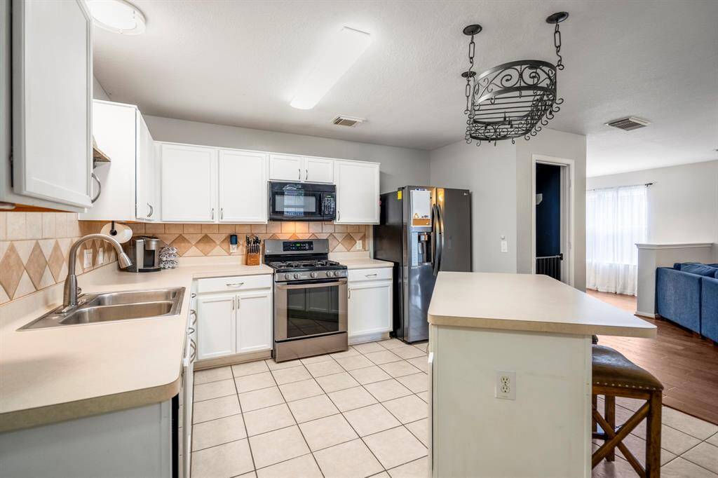 The kitchens design ensures ease of movement, making it a dream for any home chef.