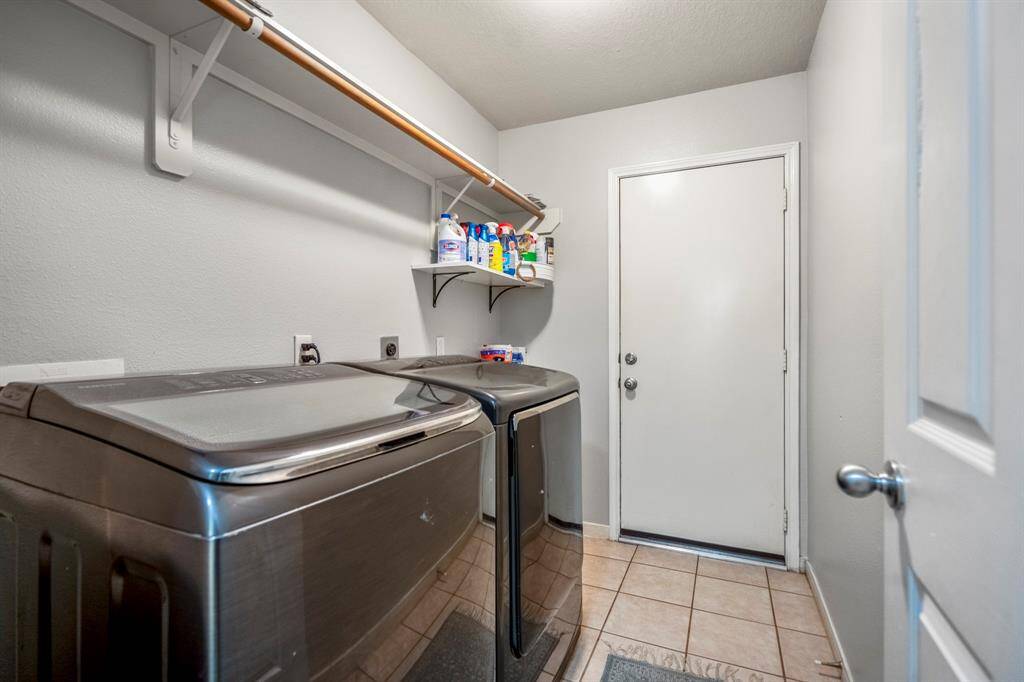 This functional laundry room is conveniently located for ease of access.