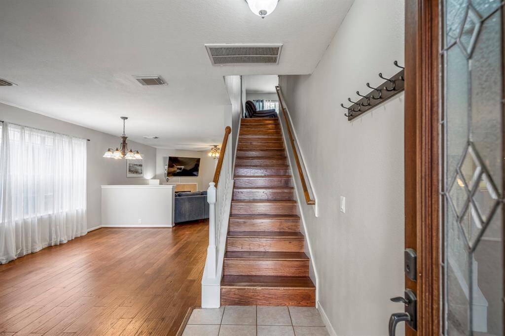 The entrance showcases beautiful the ample natural light, creating a warm and inviting atmosphere.