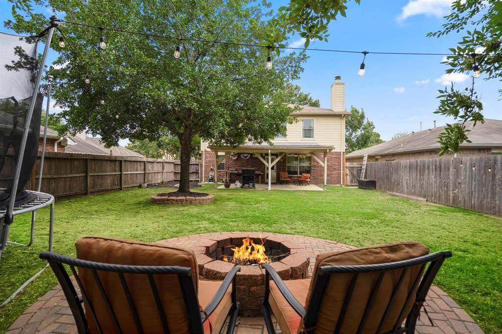 This inviting fire pit area is perfect for cozy evenings under the stars.