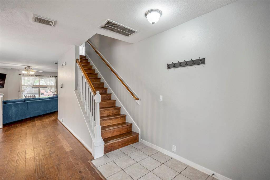 Ascend the lovely wooden staircase that leads to the private upstairs living quarters.
