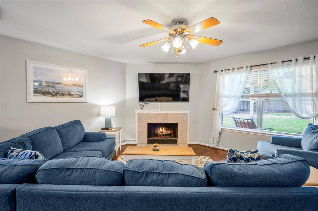Unwind in this comfortable living area featuring a charming fireplace.