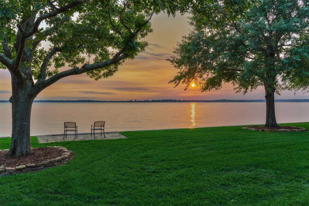 With approximately 104 ft of waterfront panoramic views, this home's location offers the perfect spot for catching sunsets over Lake Conroe.