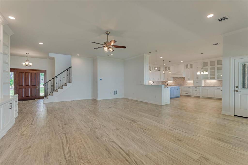 The open-concept floor plan offers a seamless flow, perfect for entertaining while creating a spacious and airy atmosphere throughout the home.