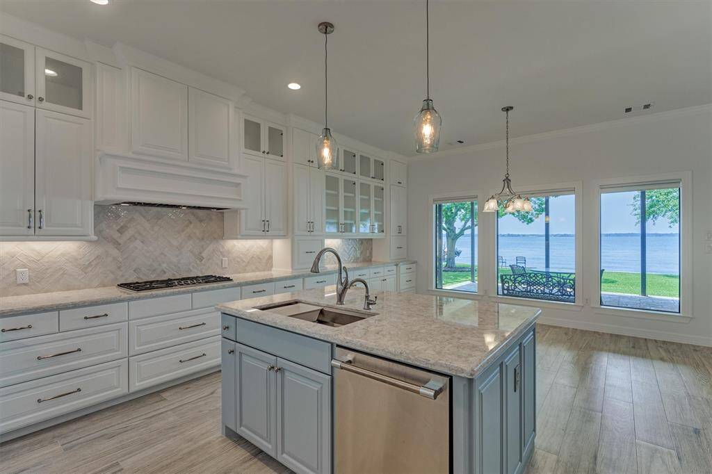 A whole-home water filtration system, along with a secondary filter beneath the kitchen sink, ensures that all water entering the home is clean, fresh, and safe for everyday use.