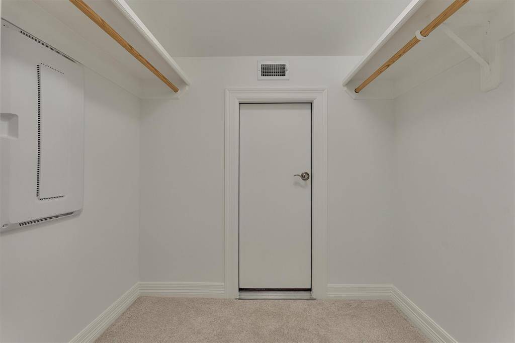 The second floor closet features multiple hanging rods and convenient door access to the attic. The attic is partially floored around the second floor area, providing easy and accessible storage.