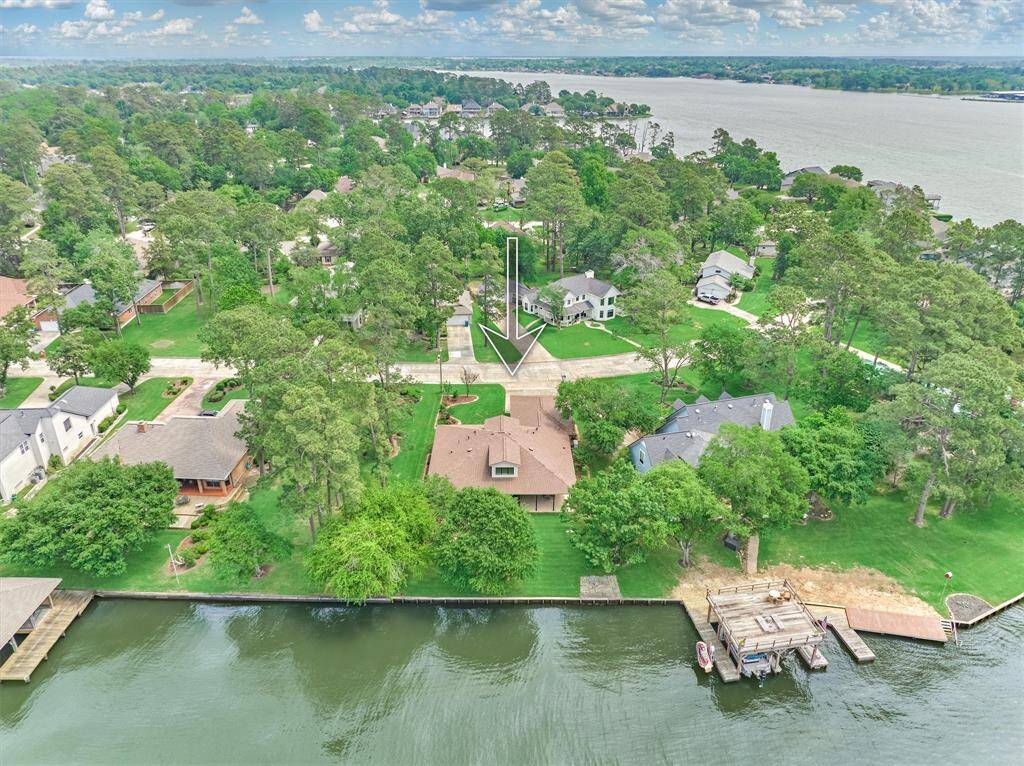 The home features a brand-new roof installed in 2025, with mature trees thoughtfully maintained to optimize solar coverage and energy efficiency.