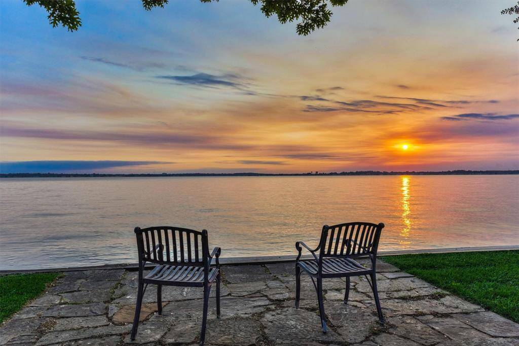 Enjoy this peaceful view every evening from your own backyard. Future plans for this area were thoughtfully considered during the remodel and the main electrical panel is plumbed to an exterior electrical box for any future wiring to the landscape or bulkhead area.