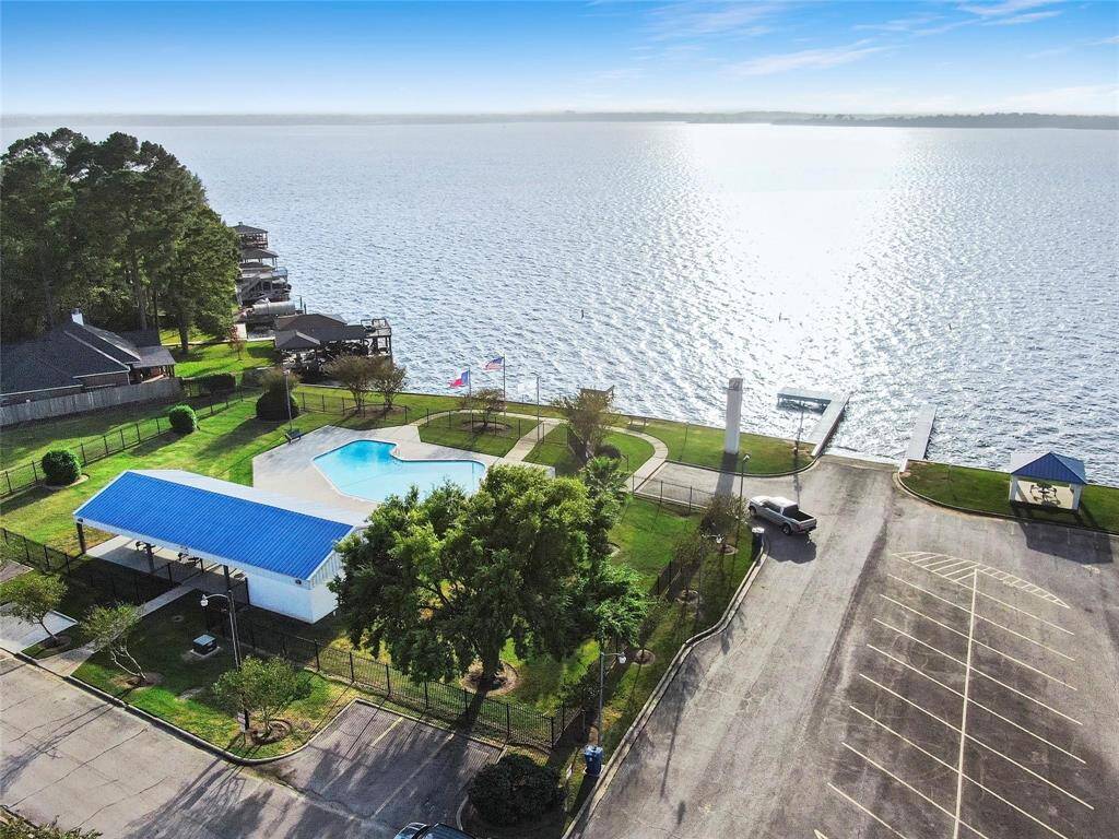 A second boat ramp is conveniently located next to the community pool, right along the scenic shoreline of Lake Conroe. Just across the street, residents can enjoy the community clubhouse and park, offering additional spaces for recreation and gatherings.