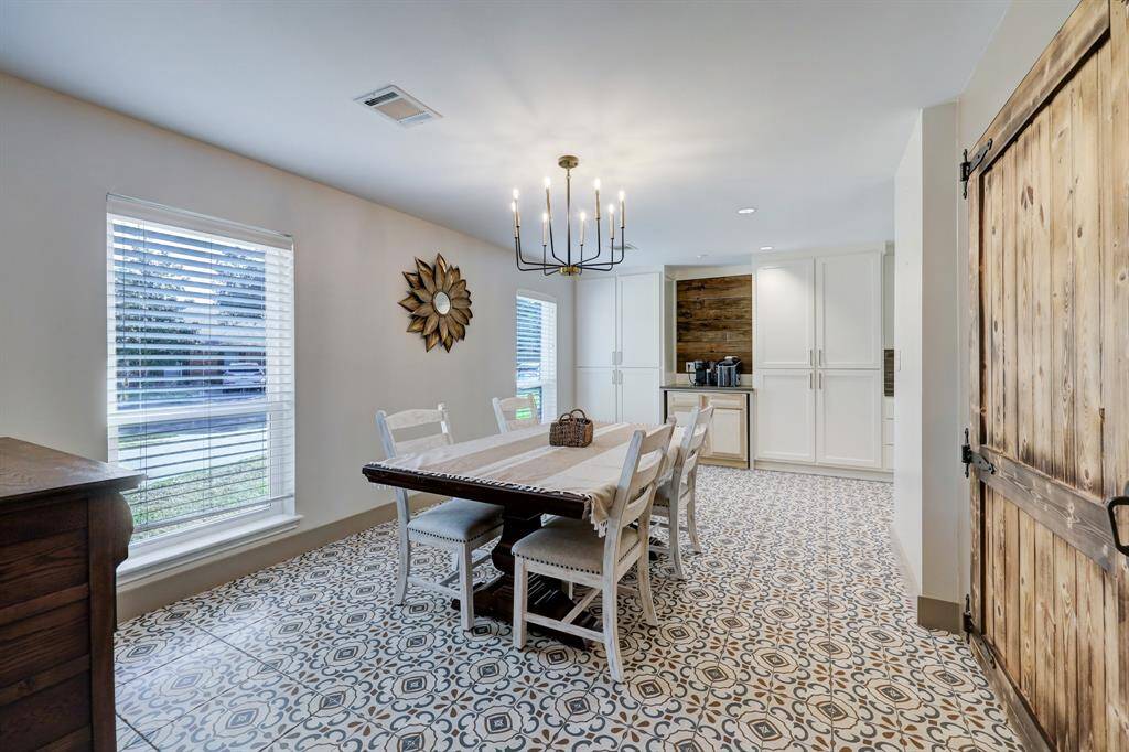 Dining room has quick access from kitchen and entry way for efficient traffic flow.