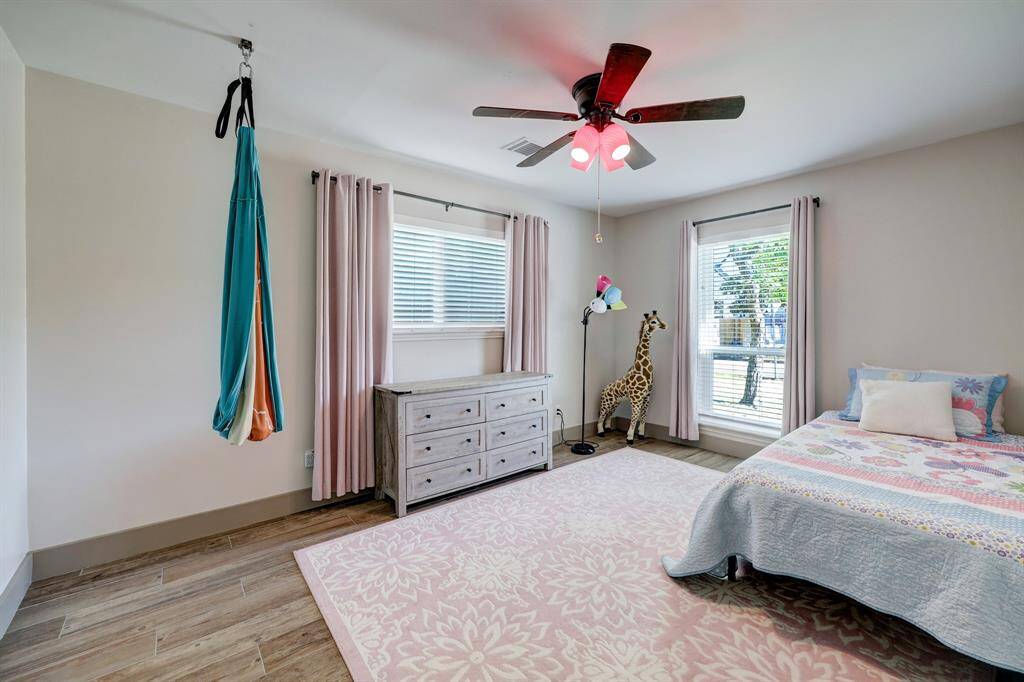 Additional corner bedroom with East and South views creating great morning light.