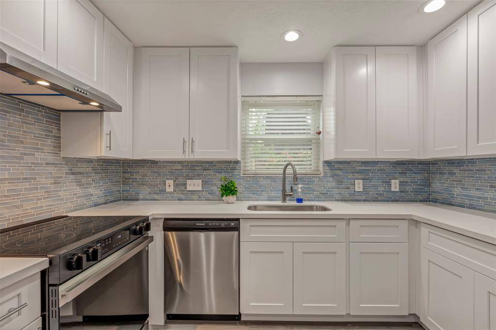 Light and bright kitchen with new solid wood cabinets, new stove, new faucet and sink.