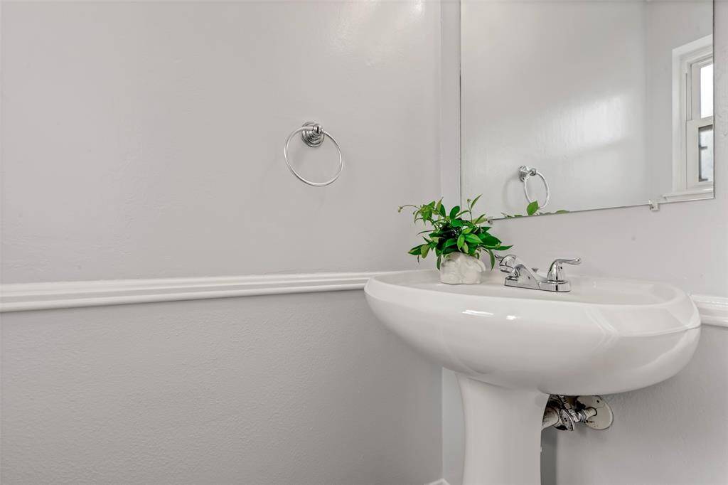 Half bathroom downstairs next to the laundry room