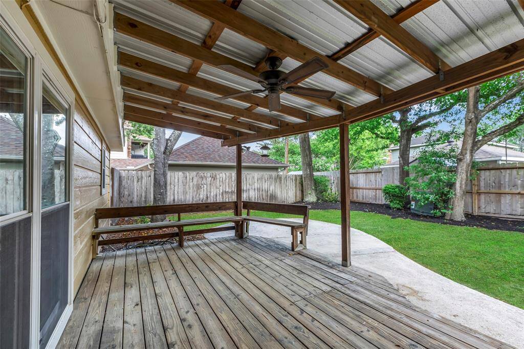 Huge covered back deck with benches.