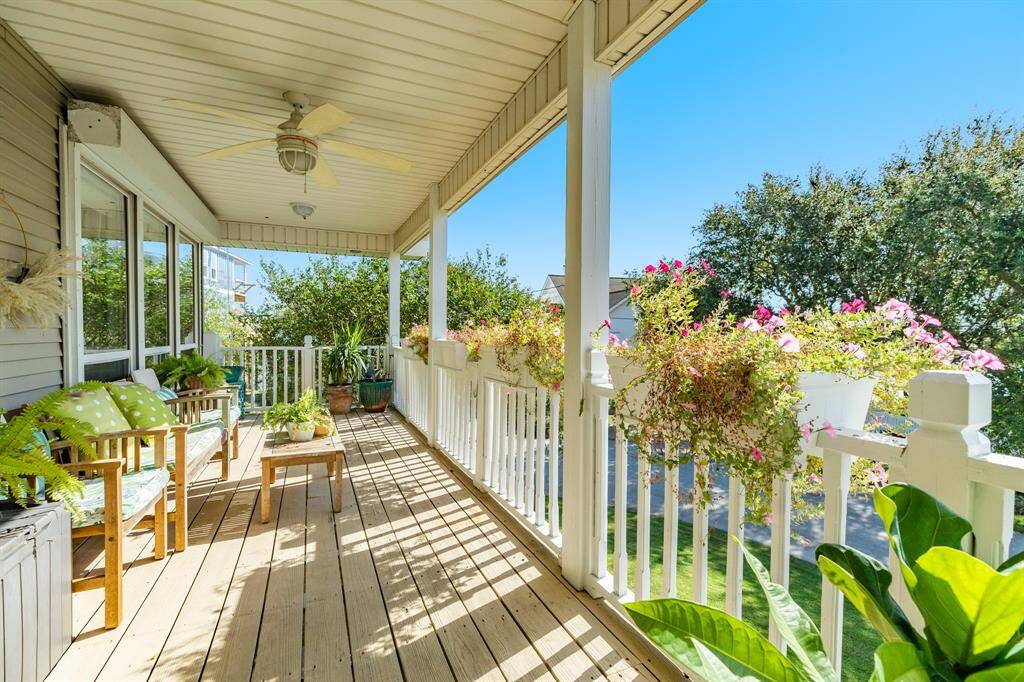 View of the upstairs porch, very peaceful and serene setting provided by the foliage and trees in the area and on the property.
