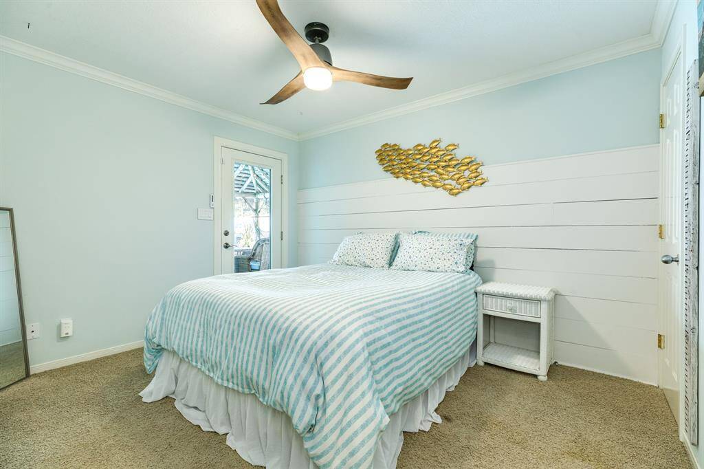 Bedroom #1. In view, this door leads out to the patio/pool entrance.