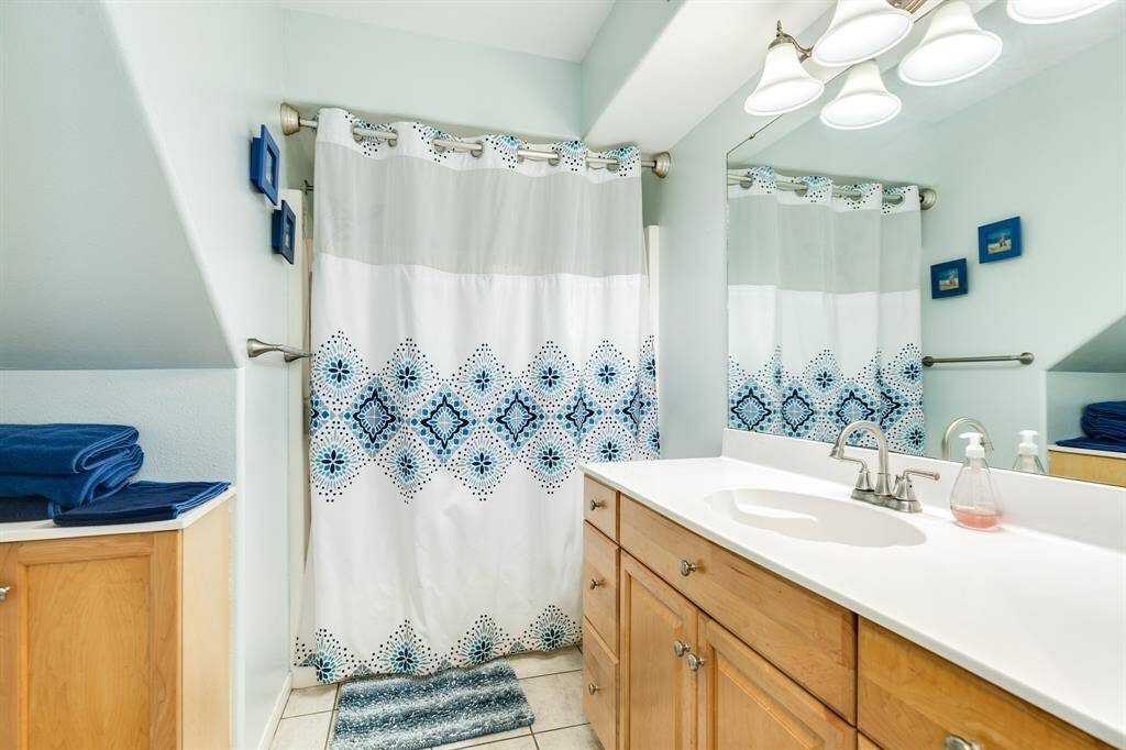 Hall bathroom on the ground floor with tub/shower arrangement.