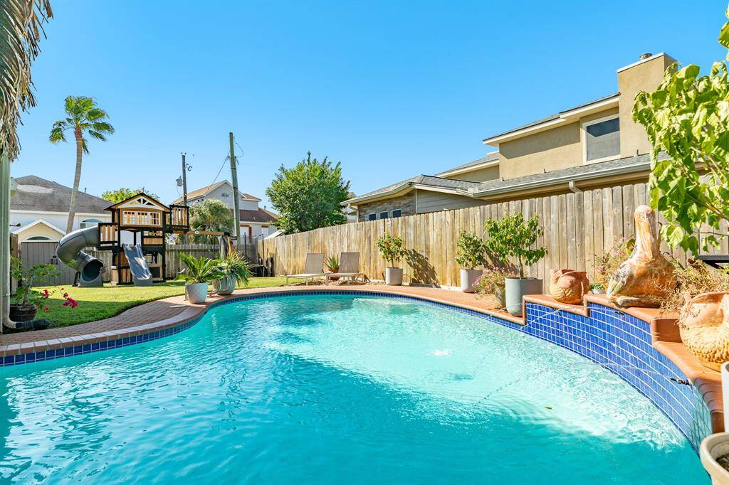 Fenced backyard provides a nice green space for children and our four legged friends.
